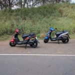 Picture of two Kymco scooter rentals on Maui parked not eh side of the road